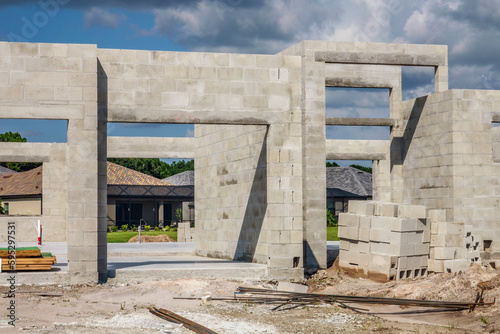 Unfinished concrete walls of single-family house under construction in a suburban development in southwest Florida