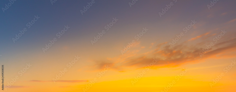 clouds and orange sky,Real amazing panoramic sunrise or sunset sky with gentle colorful clouds. Long panorama, crop it