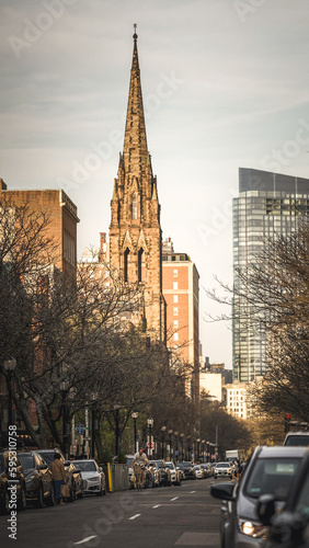 Biker in front of Church of the Covenant with Boston Skyline