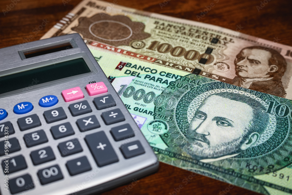 Paraguay money with calculator, financial concept, budget calculation Paraguay money with calculator, financial concept, budget calculation