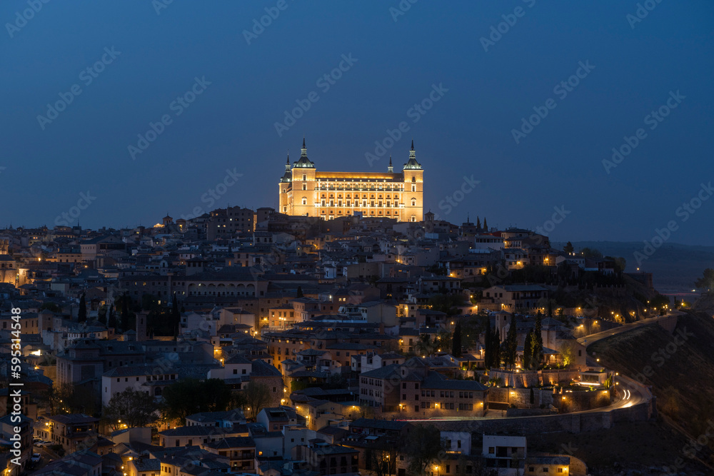 Toledo, Spain - April 9, 2023: Panoramic view of the city of Toledo at night, The Alcazar