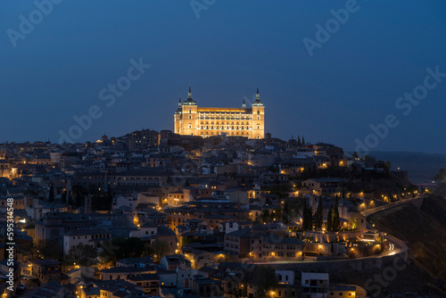 Fototapeta Naklejka Na Ścianę i Meble -  Toledo, Spain - April 9, 2023: Panoramic view of the city of Toledo at night, The Alcazar