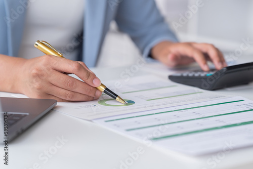 Accountant analyzing business marketing data on paper dashboard Corporate finance office table. 