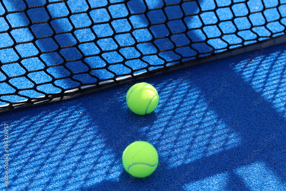 Paddle balls on a blue court