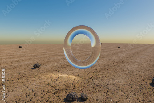 Valokuva single glas ring hovering in the air in large empty desert environment; abstract