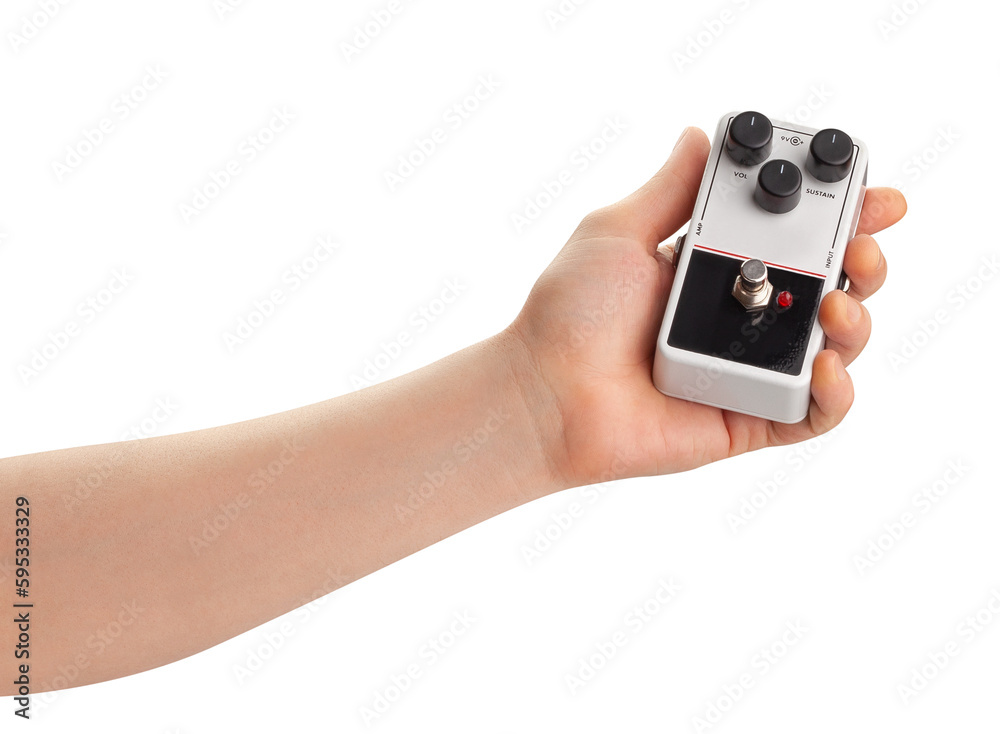 guitar fuzz pedal in hand path isolated on white guitar fuzz pedal in hand path isolated on white