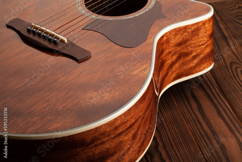 acoustic guitar bridge saddle nut on wood photo