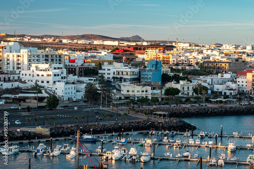 Fototapeta Naklejka Na Ścianę i Meble -  Top view of port of Puerto Del Rosario city on the Fuerteventura Canary Island at sunshine. Spain