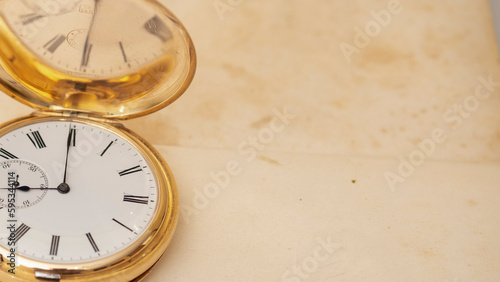 vintage gold pocket watch longines isolated on white background, pocket watch on books background