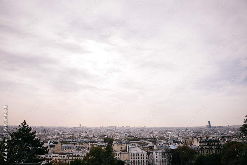 View of the Paris Cityscape from Montmartre Sacre Coeur in Paris, France on an overcast day 