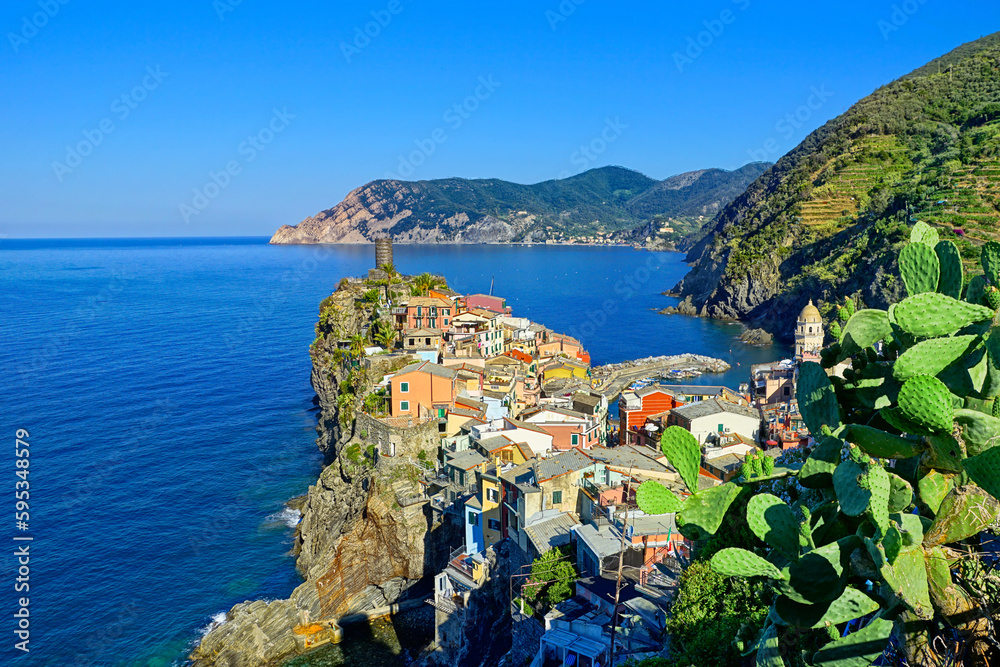 Picturesque Cinque Terre village of Vernazza, Italy. View from above over the town and the blue sea.