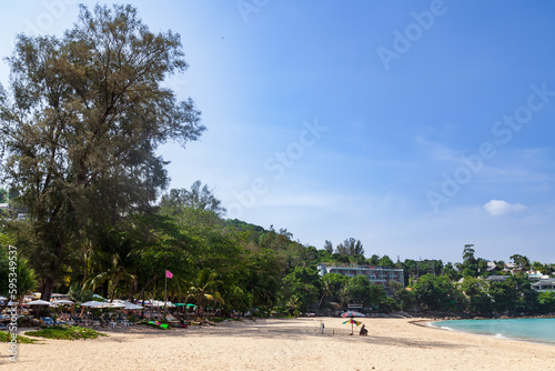 Beautiful Surin beach in Choeng Thale city, Phuket, Thailand with white sand, turquoise water and palm trees © Aleksandr Kondratov