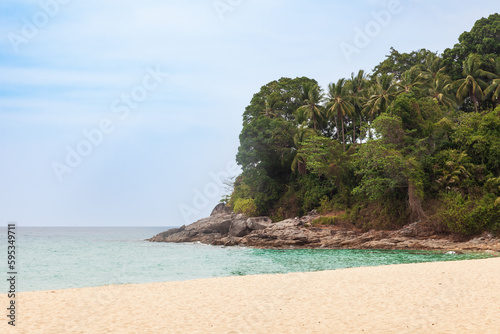 Beautiful Surin beach in Choeng Thale city, Phuket, Thailand with white sand, turquoise water and palm trees