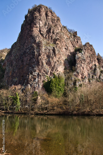 Rock cliff behind the Nahe River in Bad Kreuznach, Germany on a sunny winter day.