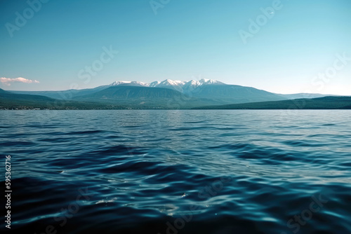 Wallpaper Mural mountain landscape with a crystal-clear lake in the foreground and snow-capped peaks in the background, generative ai Torontodigital.ca