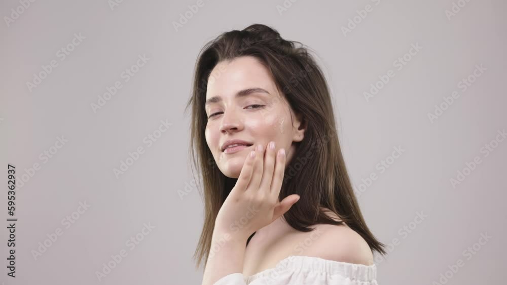 beautiful girl with a smiling face and holding a pipette with serum in front of her face, beauty with makeup and a perfect smile beautiful girl with a smiling face and holding a pipette with serum in front of her face, beauty with makeup and a perfect smile