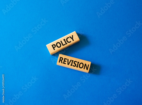 Policy revision symbol. Concept word Policy revision on wooden blocks. Beautiful blue background. Business and Policy revision concept. Copy space