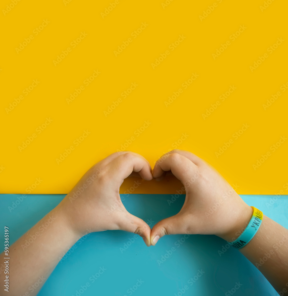 Fototapeta premium Children's hands on a colored background