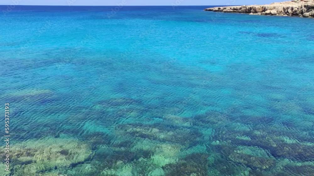 Blue lagoon with corals and yellow rock on the horizon, vacation spirit and vibes. Blue lagoon with corals and yellow rock on the horizon, vacation spirit and vibes.