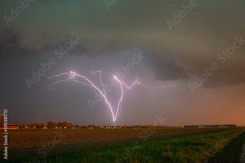 Upward lightning bolt initiated by a windturbine along highway A12 in The Netherlands