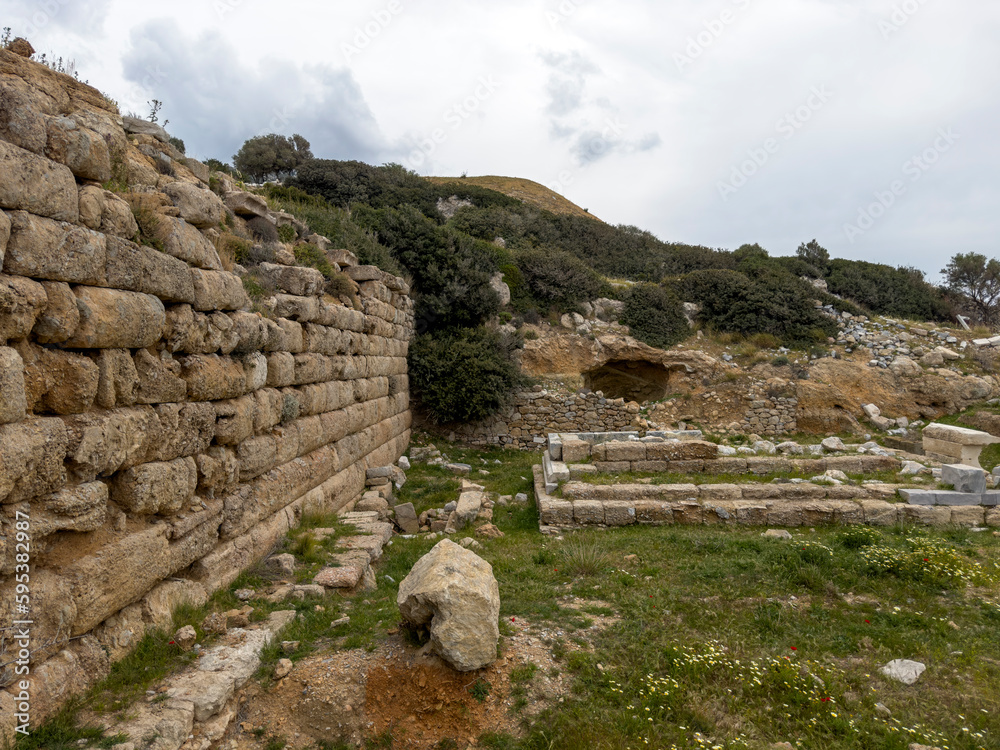 The historical stone walls of the ancient city in the Aegean region