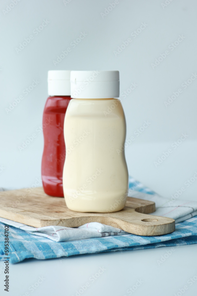 close up of Mayonnaise in container on table . close up of Mayonnaise in container on table .