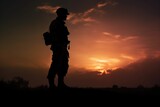 Silhouette of a soldier in war at sunset.
