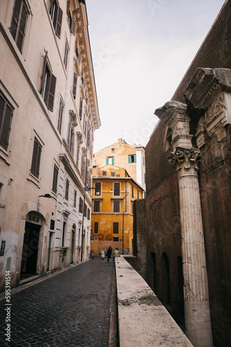 Walking through the city streets of ancient Rome in Italy © MylesK