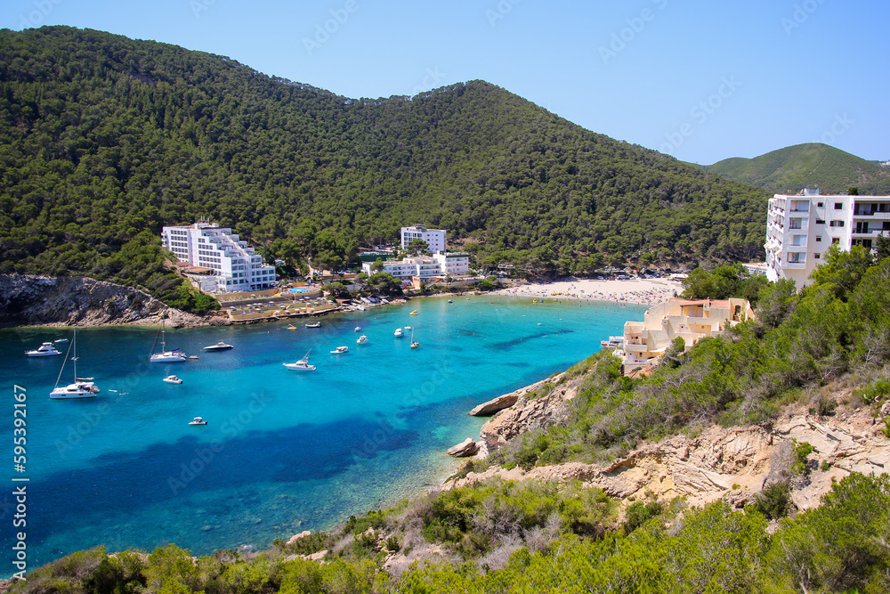 Cala Llonga bay on the southern side of Ibiza in the Balearic islands in the Mediterranean Sea - Cove with turquoise waters surrounded with pine covered hills