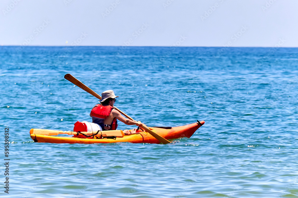 man paddling in a kayak