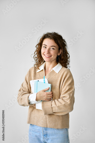 Young happy pretty cute girl student holding digital tablet, using tab computer standing isolated at white background advertising online education course on smart technology, vertical.