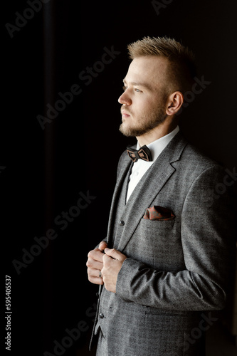 portrait of a businessman and famous person. gorgeous fiance. wedding concept. young groom in a suit