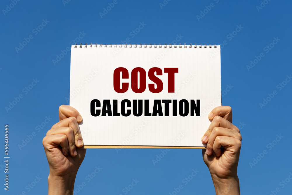 Cost calculation text on notebook paper held by 2 hands with isolated blue sky background. This message can be used as business concept about cost calculation. Cost calculation text on notebook paper held by 2 hands with isolated blue sky background. This message can be used as business concept about cost calculation.