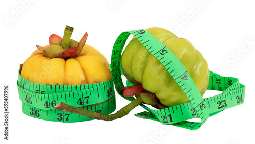 Garcinia atroviridis and tape measure on transparent background. photo