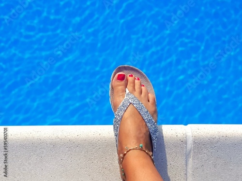 Woman feet in pool © Nicole