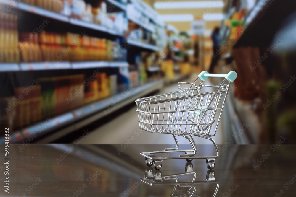 Supermarket cart with out-of-focus aisle 