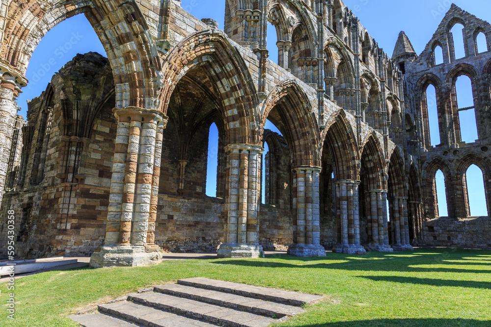 England, North Yorkshire, Whitby. North Sea, East cliff. English Heritage site, ruins of Benedictine abbey, Whitby Abbey, monastery.