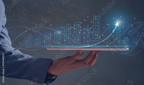Businessmen touching the virtual screen with the stock market changes, business growth investment bar chart, and more candlesticks connected to trade data, businessmen pointing the arrow.