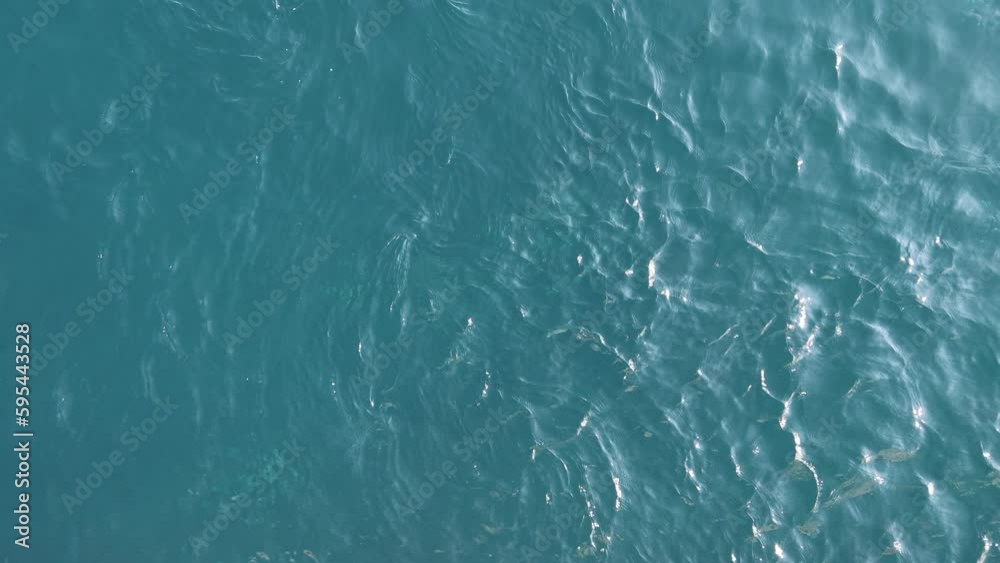 sea ​​with waves and clear sky, calm ocean water surface with small ripples