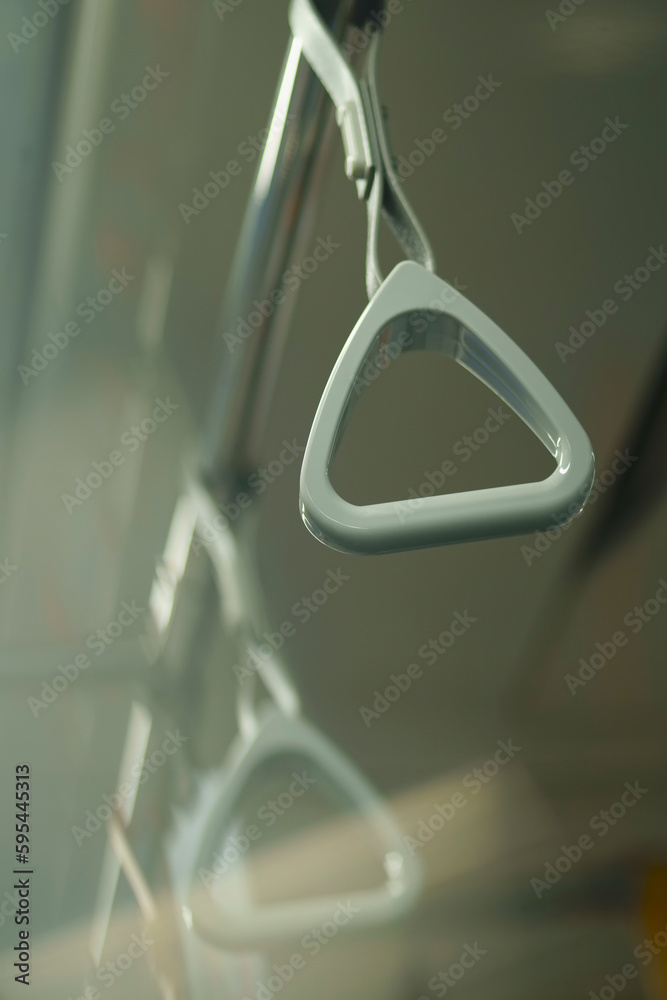 Close up and selective focus of grey triangle handle bar in the train. Close up and selective focus of grey triangle handle bar in the train.