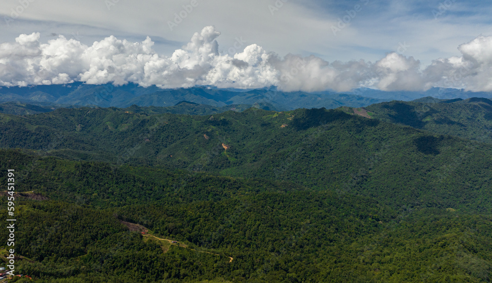 Jungle and mountains in Borneo. Mountain slopes with tropical vegetation. Sabah, Malaysia.