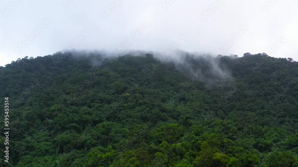The mountains are covered in rainforest. Mountain peaks in a tropical climate. Highlands on Luzon Island, Philippines. The mountains are covered in rainforest. Mountain peaks in a tropical climate. Highlands on Luzon Island, Philippines.