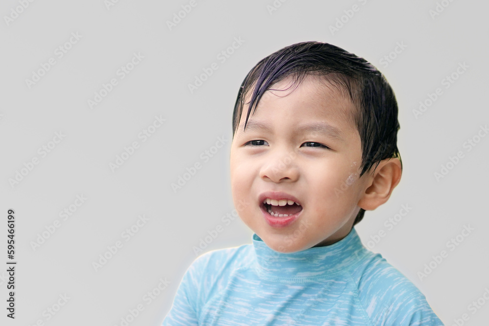 Angry Asian boy frowning, looking forward. Light background. Closeup shot of Angry grimace boy grimace and pout. Portrait Asian Boy with Emotional facial expression. Angry Asian boy frowning, looking forward. Light background. Closeup shot of Angry grimace boy grimace and pout. Portrait Asian Boy with Emotional facial expression.
