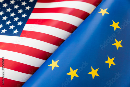 Background of the flags of the USA and European Union. The concept of interaction or counteraction between two countries. International relations. political negotiations. Sports competition.