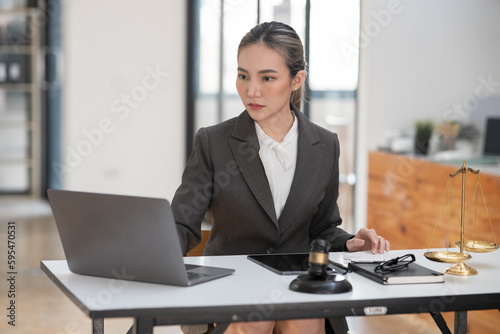 Lawyers Asiawoman having through online Concepts of Legal services at the law office.