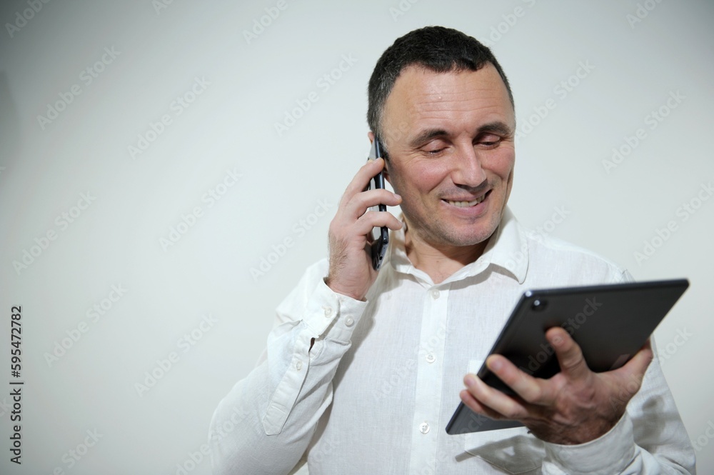 Master of my field. Shot of a young businessman using his digital tablet. High quality photo Master of my field. Shot of a young businessman using his digital tablet. High quality photo