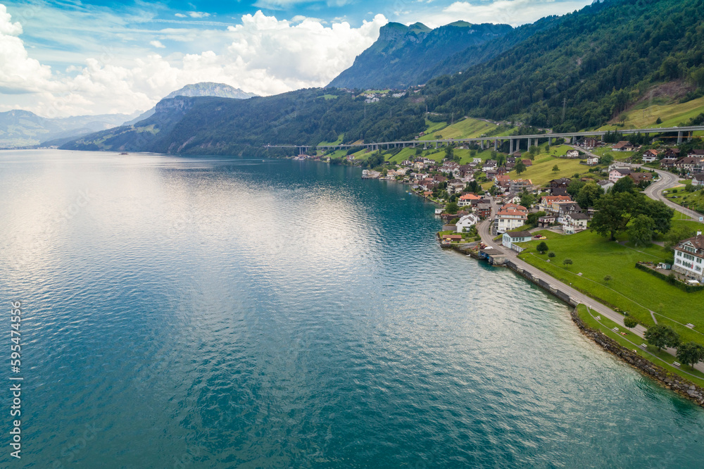Aerial view of Lucerne lake with  a village and mountains, Switzerland