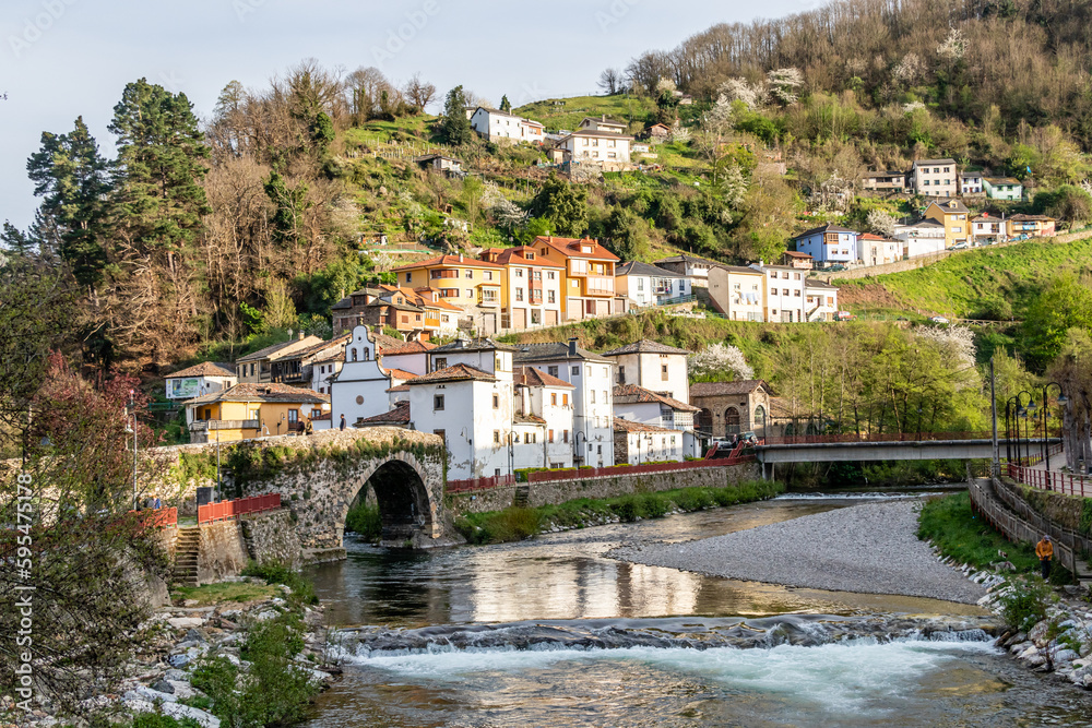 bridge of Roman origin on the Narcea river as it passes through the center of the city of Cangas del Narcea in Asturias, Spain