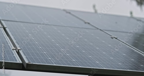 Solar panel in cloudy weather. Close-up. Concept of uselessness of alternative energy sources in bad weather. No electricity, no power.