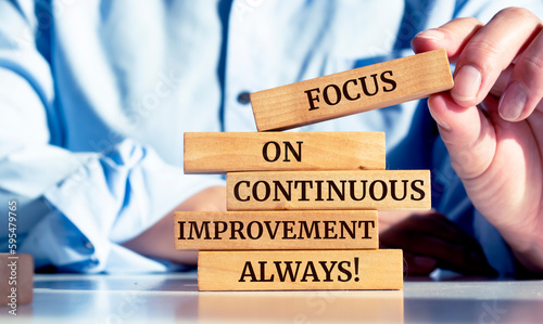 Close up on businessman holding a wooden block with a 